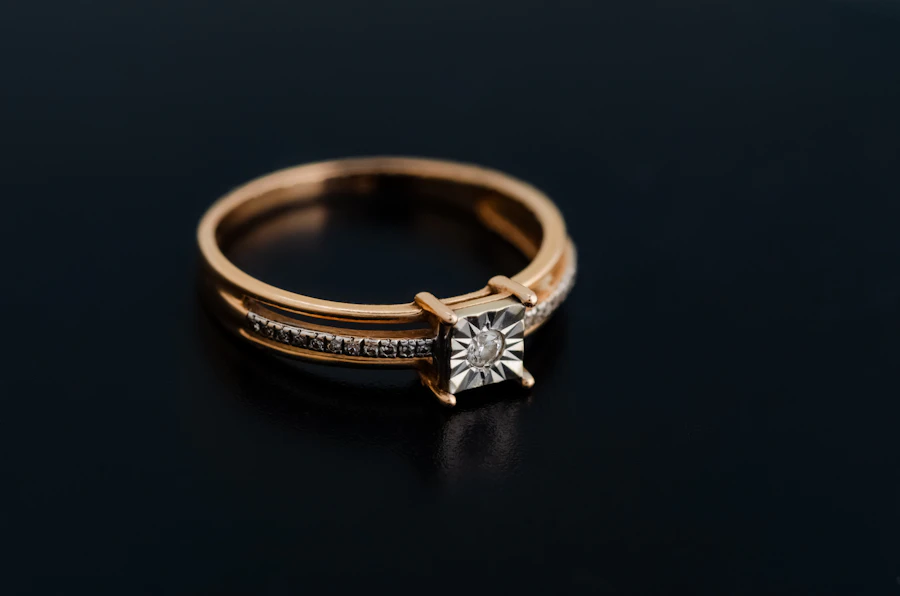 Rose gold ring with an illusion-set diamond on black
